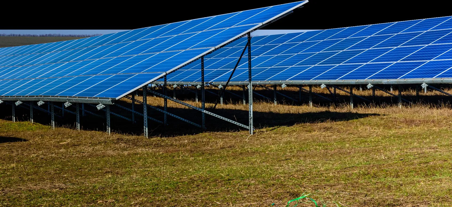 Ground-mounted solar farm at sunrise in Una