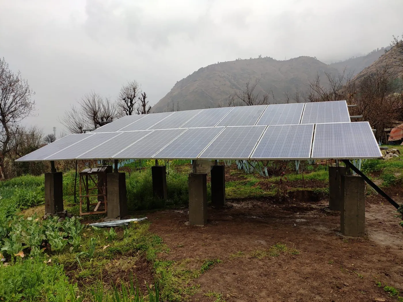 Ground-mounted solar array on hilly terrain